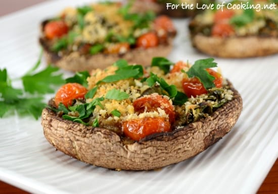 Roasted portobello mushrooms stuffed with spinach and tomatoes