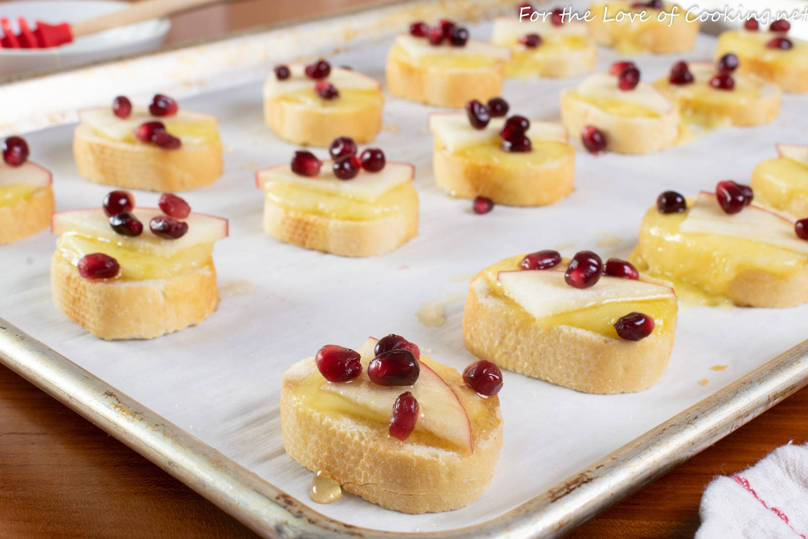 Brie Apple Crostini with Honey and Pomegranate Seeds